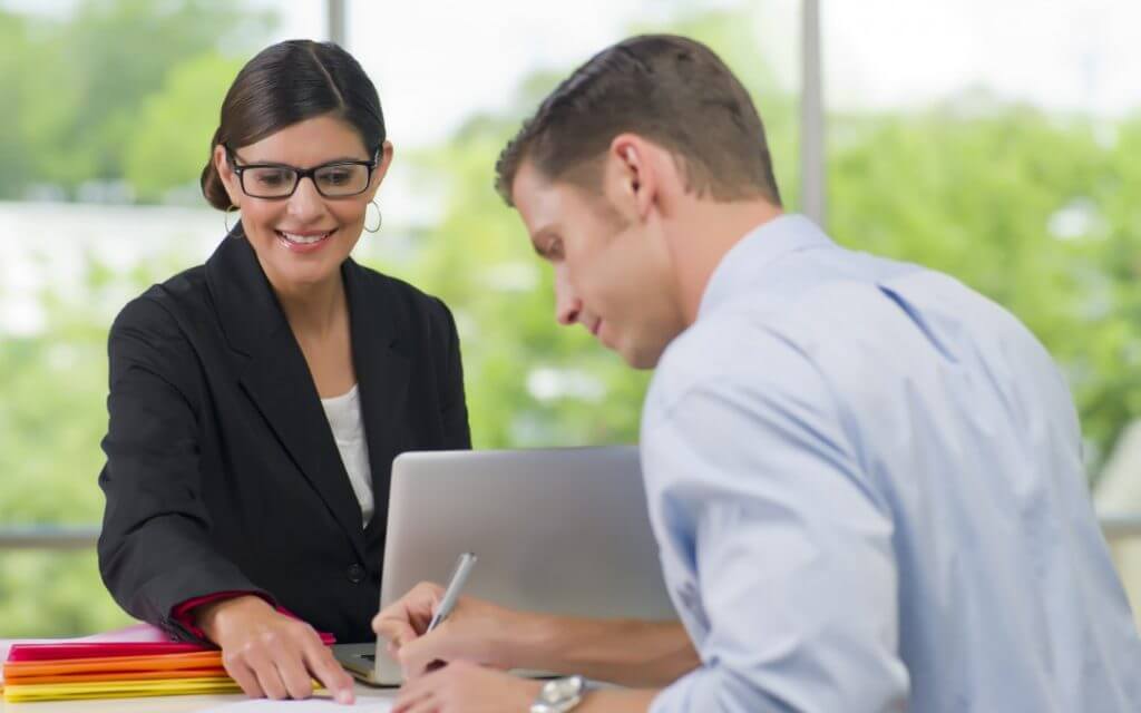 Stock photo of a loan officer helping out a customer