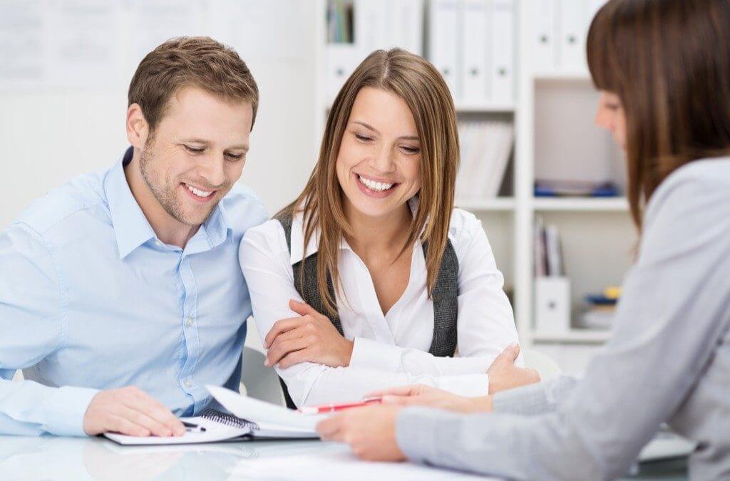 Couple being presented options to buy a house